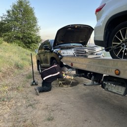 My car being hitched up to the back of the tow truck. My car being hitched up to the back of the tow truck.