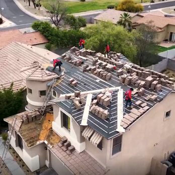 Lyons Roofing - Lyons roofers hard at work stacking roof tile on top of new underlayment to finish new roof installation. - Roofing Near Me - Phoenix, Arizona Lyons Roofing - Lyons roofers hard at work stacking roof tile on top of new underlayment to finish new roof installation. - Roofing Near Me - Phoenix, Arizona