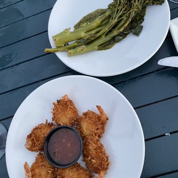 The Rooftop Lounge - Coconut shrimp and broccolini (both starters) - Lounges Near Me - Laguna Beach, California The Rooftop Lounge - Coconut shrimp and broccolini (both starters) - Lounges Near Me - Laguna Beach, California