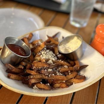 Monkeypod Kitchen - Hand cut hand made garlic truffle fries with Parmesan & aioli sauce  Appetizer! Yummy - Hawaiian Near Me - Kapolei, Hawaii