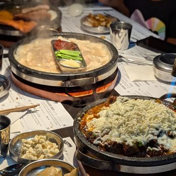 Dawa Kitchen - Not sure if you can tell, but he's torching the cheese. You can request the cheese to be crispy or regular. - Korean Near Me - Garden Grove, California