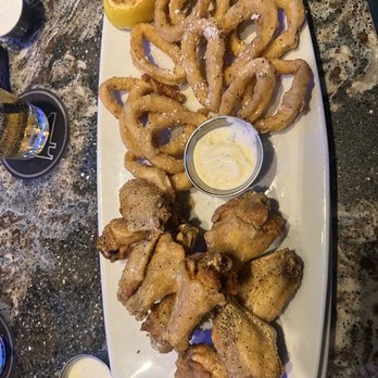 54th Street Restaurant & Drafthouse - Garlic lemon pepper wings and calamari - Bars Near Me - San Antonio, Texas
