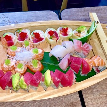 Sushi Gio - I love that multiple rolls (any) would come in this boat - Japanese Near Me - Mansfield, Texas