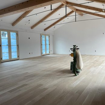Garibay Hardwood Floors - a large room with wooden beams - Flooring Near Me Garibay Hardwood Floors - a large room with wooden beams - Flooring Near Me