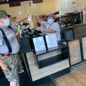 The Purple Cactus - a man and a woman wearing face masks - Mexican Near Me - Jamaica Plain, Massachusetts The Purple Cactus - a man and a woman wearing face masks - Mexican Near Me - Jamaica Plain, Massachusetts