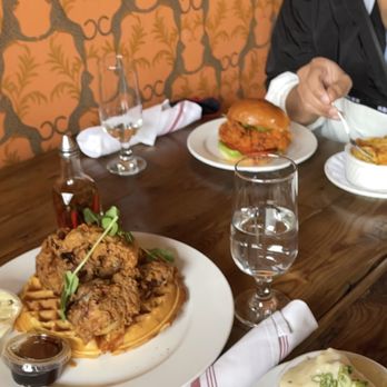 Revival - Regular Chicken & Waffles  + Mashed Potatoes. Chicken sandwich (in back)  (St. Paul location). - Southern Near Me - Minneapolis, Minnesota