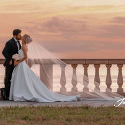 Bride and groom sharing a kiss during sunset at Epping Forest Yacht Club