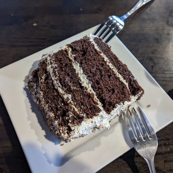 Carl & 'Chelle's Grill Room - The Hershey Bar Cake is not to be missed! A decadent way to finish any meal at Carl & Chelles. - American Near Me - Goldsboro, North Carolina Carl & 'Chelle's Grill Room - The Hershey Bar Cake is not to be missed! A decadent way to finish any meal at Carl & Chelles. - American Near Me - Goldsboro, North Carolina