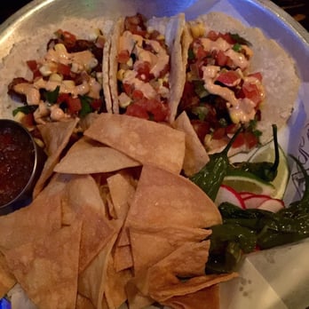 Basin 141 - Pork belly tacos with some chilies tortilla chips and radishes - Pubs Near Me - Montrose, California