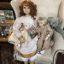This doll creeps my kid out so badly. She refuses to go near it. What do I do? Take a photo so I can show it to her all the time.