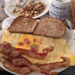 Country Junction Restaurant - Western omelette bacon ritos sausage gravy over biscuit home fries