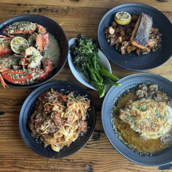 Water Street Kitchen and Bar - Roasted Maine lobster, crispy salmon, chicken Madeira, half bolognese, broccolini - Wine Bars Near Me - Wiscasset, Maine Water Street Kitchen and Bar - Roasted Maine lobster, crispy salmon, chicken Madeira, half bolognese, broccolini - Wine Bars Near Me - Wiscasset, Maine
