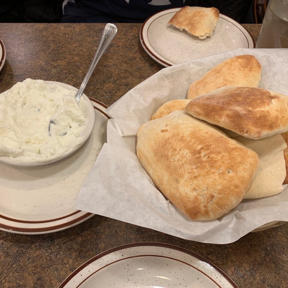 Farm Grill - a plate of pita bread and a bowl of dip - Mediterranean Near Me - Novi, Michigan Farm Grill - a plate of pita bread and a bowl of dip - Mediterranean Near Me - Novi, Michigan