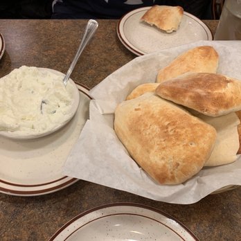 Farm Grill - a plate of pita bread and a bowl of dip - Mediterranean Near Me - Novi, Michigan Farm Grill - a plate of pita bread and a bowl of dip - Mediterranean Near Me - Novi, Michigan