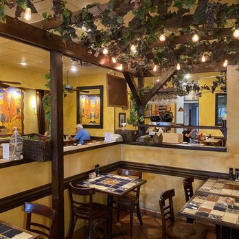 C'est La Vie - Inside seating with table service. - French Near Me - Sarasota, Florida
