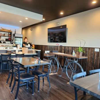 Koya Sushi - Dining area. One of our servers at register. Service was very good. - Japanese Near Me - Beaverton, Oregon
