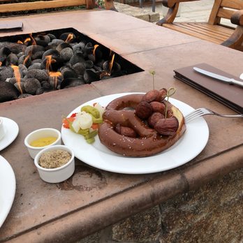 The Inn at Spanish Bay - Bavarian sausage and pretzel, spicy mustard at firepit - Hotels Near Me - Pebble Beach, California The Inn at Spanish Bay - Bavarian sausage and pretzel, spicy mustard at firepit - Hotels Near Me - Pebble Beach, California