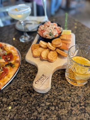 Photo of Cedar Ridge Winery & Distillery - Swisher, IA, US. a pizza and appetizer