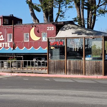 Dad's Luncheonette - Old Caboose Car is the kitchen, storage area and a small counter for serving during non-Covid times.  A glassed in patio area is attached. - New American Near Me - Half Moon Bay, California