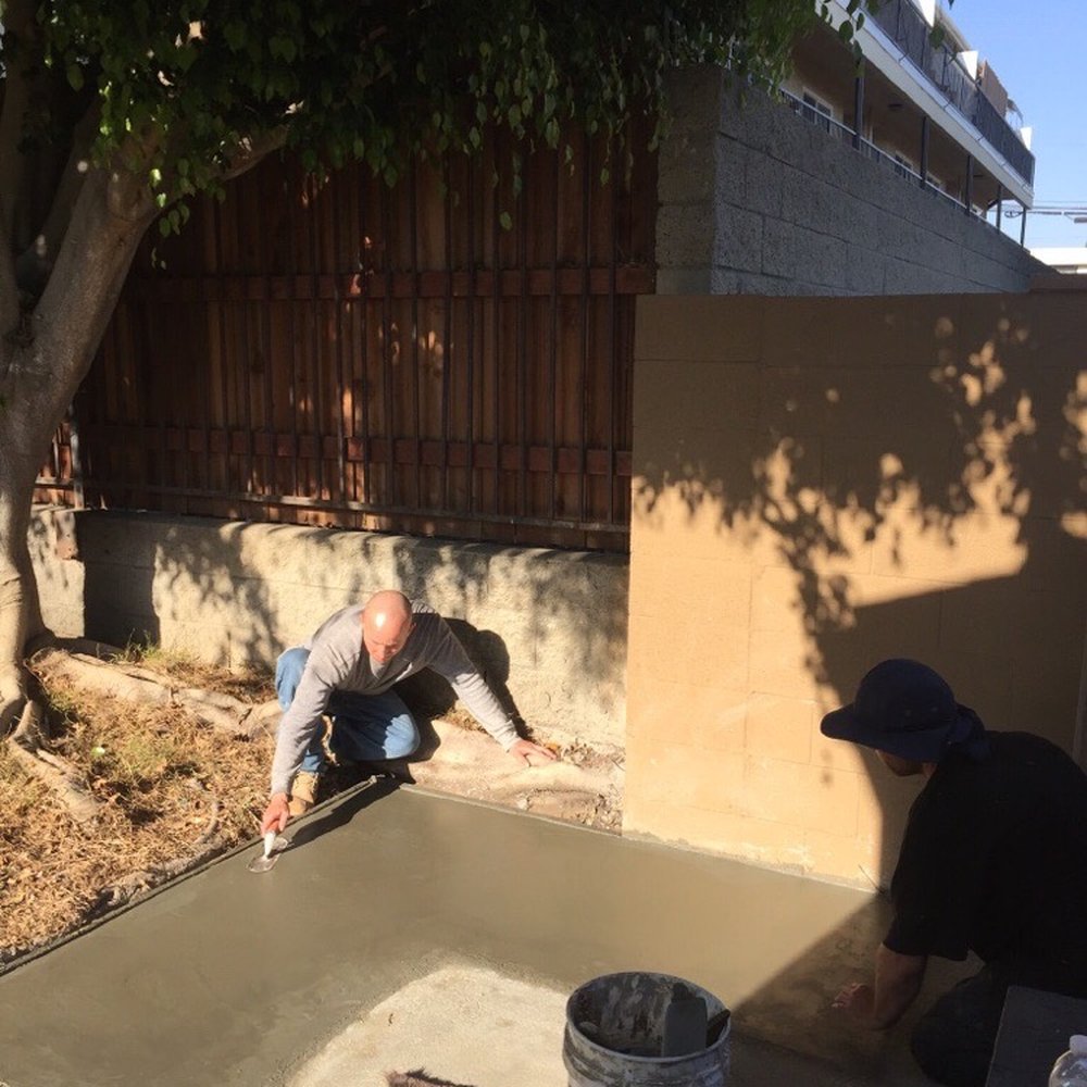 Lennon's Concrete Pumping Service - 2. Team smoothing poured concrete - Masonry/Concrete Near Me - venice, California