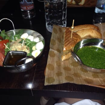 Sienna Mercato - Pork panini with Gouda & spinach almond pesto on the right. Rocket salad on the left - Italian Near Me - Pittsburgh, Pennsylvania