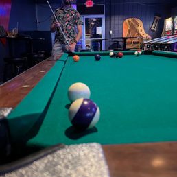 a man playing pool a man playing pool