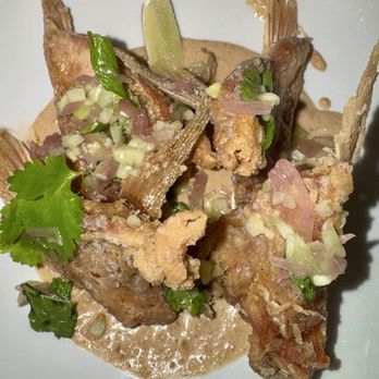 Compère Lapin - Snapper collar in a Caribbean curry peanut sauce - Caribbean Near Me - New Orleans, Louisiana