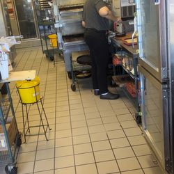 Pizza Hut - This lady handling ready to eat food with no gloves. She don't know she can't do that but knows about ETA dogs
