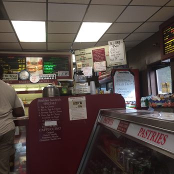 Doe E Duck Donuts - a man standing at the counter - Donuts Near Me - Brockton, Massachusetts