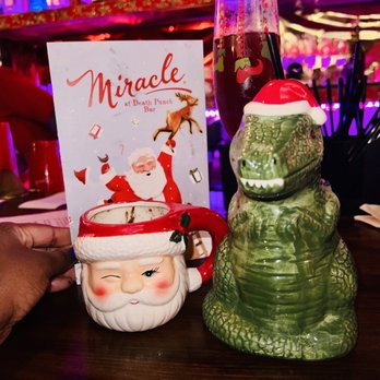 Death Punch - a christmas drink and a book on a table - Cocktail Bars Near Me - Washington, DC, District of Columbia