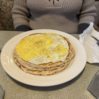 Scrambled Yolk - Pancake sandwich, two eggs and ham inside fluffy pancakes. - Breakfast & Brunch Near Me - Watertown, Wisconsin Scrambled Yolk - Pancake sandwich, two eggs and ham inside fluffy pancakes. - Breakfast & Brunch Near Me - Watertown, Wisconsin