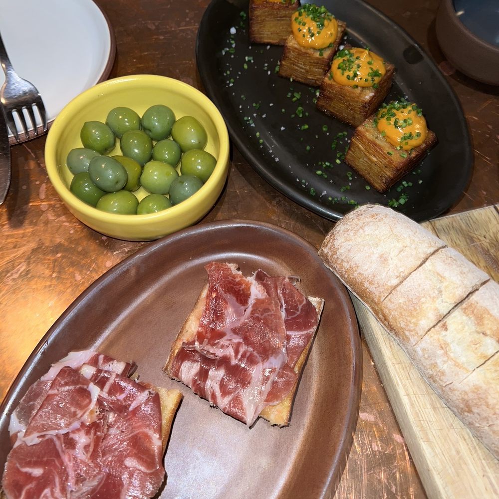 Valentina - Ham on tomato toast, patatas bravas, and sides of olives and bread - Seafood Near Me - Encinitas, California Valentina - Ham on tomato toast, patatas bravas, and sides of olives and bread - Seafood Near Me - Encinitas, California