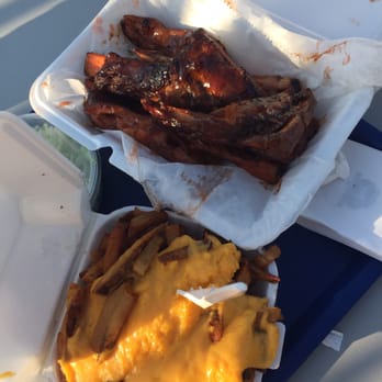 Chaps Pit Beef - 1/2 pound of ribs with sauce (BBQ) and a side of cheese fries - Barbeque Near Me - Baltimore, Maryland Chaps Pit Beef - 1/2 pound of ribs with sauce (BBQ) and a side of cheese fries - Barbeque Near Me - Baltimore, Maryland