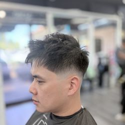 Mid skin fade by Christy
