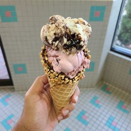 KitKat and pink cherry vanilla flavors in a cone KitKat and pink cherry vanilla flavors in a cone