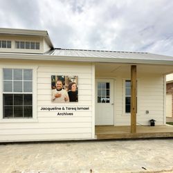 Saifee Signs & Graphics - Exterior signage and photo panel installed by Saifee Signs for the Jacqueline & Tareq Ismael Archives, blending branding and tribute in one