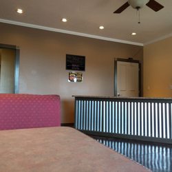Suds & Duds Laundromat - Comfy seating area with wide tables and outlets.