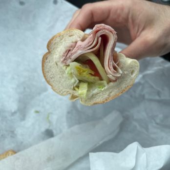 Bevan's Cold Cuts - a person holding a sandwich - Sandwiches Near Me - West Chester, Pennsylvania Bevan's Cold Cuts - a person holding a sandwich - Sandwiches Near Me - West Chester, Pennsylvania