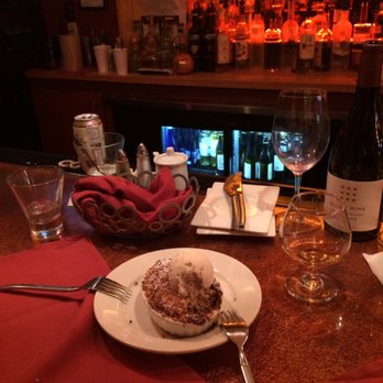 Bin 100 Restaurant - Desert delivered with dirty dishes and glasses still on the bar. - Italian Near Me - Milford, Connecticut Bin 100 Restaurant - Desert delivered with dirty dishes and glasses still on the bar. - Italian Near Me - Milford, Connecticut