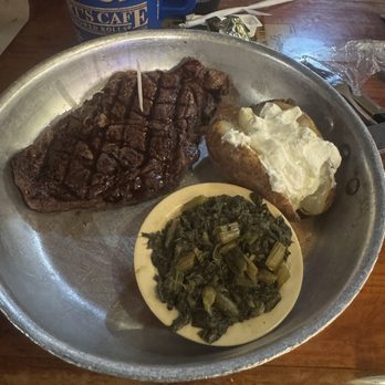 Lambert's Cafe - Ribeye with turnip greens and a baked potato. - Seafood Near Me - Foley, Alabama