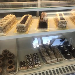 a variety of pastries in a display case