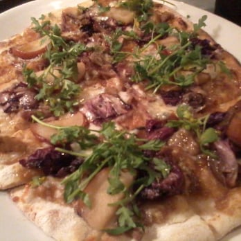 Revival Bar & Kitchen - Duck and pear flatbread with greens. Must order! - New American Near Me - Berkeley, California Revival Bar & Kitchen - Duck and pear flatbread with greens. Must order! - New American Near Me - Berkeley, California