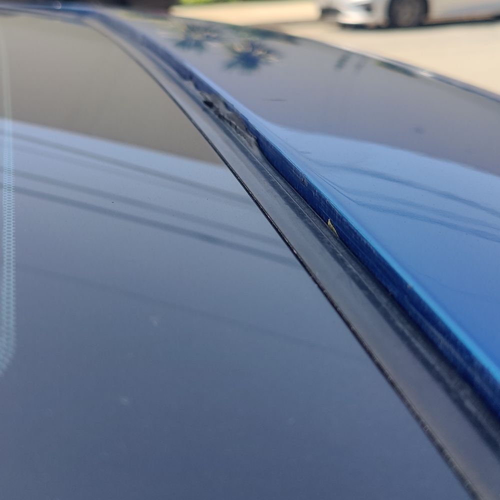 Absolute Collision Center - front of sunroof glass seal torn - Body Shops Near Me - Pico Rivera, California Absolute Collision Center - front of sunroof glass seal torn - Body Shops Near Me - Pico Rivera, California