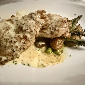 Eddie V's Prime Seafood - ROASTED DOUBLE BREAST OF CHICKEN with Lemon-Garlic Butter Sauce, Fingerling Potatoes, Asparagus - Seafood Near Me - Palm Desert, California