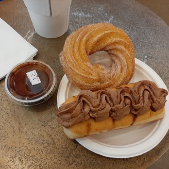 Cardigan Donuts - Churro donut with chocolate ganache and cherry almond fudge donut - Donuts Near Me - Minneapolis, Minnesota Cardigan Donuts - Churro donut with chocolate ganache and cherry almond fudge donut - Donuts Near Me - Minneapolis, Minnesota