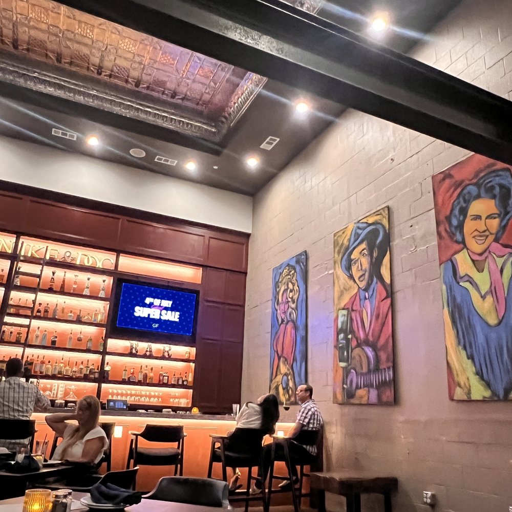 34 Chop House - Doc's lounge is quiet enough to hold a convo when live music isn't taking place. - Steakhouses Near Me - Denison, Texas