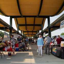 Portage Zhang Farmers Market - Shoppers and vendors in the East Pavilion, view facing south.
