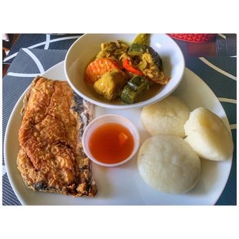 Tagpuan - a plate of food on a table - Filipino Near Me - Toronto, Ontario
