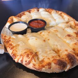 McClain's Pizzeria - Cheesy Bread. Free with a large pizza on Saturdays.