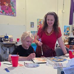 Painting Paradise - Marionette teaching her plumeria watercolor class